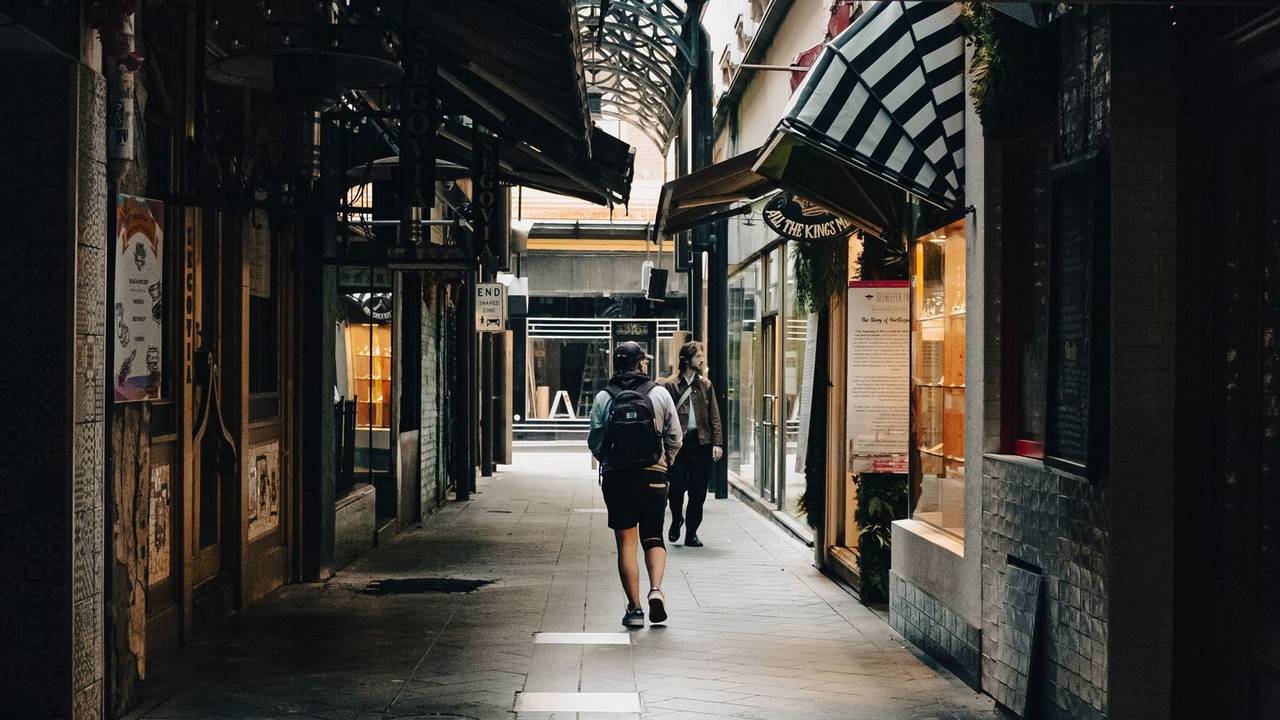 Charming Melbourne laneway with shopfronts and pedestrians